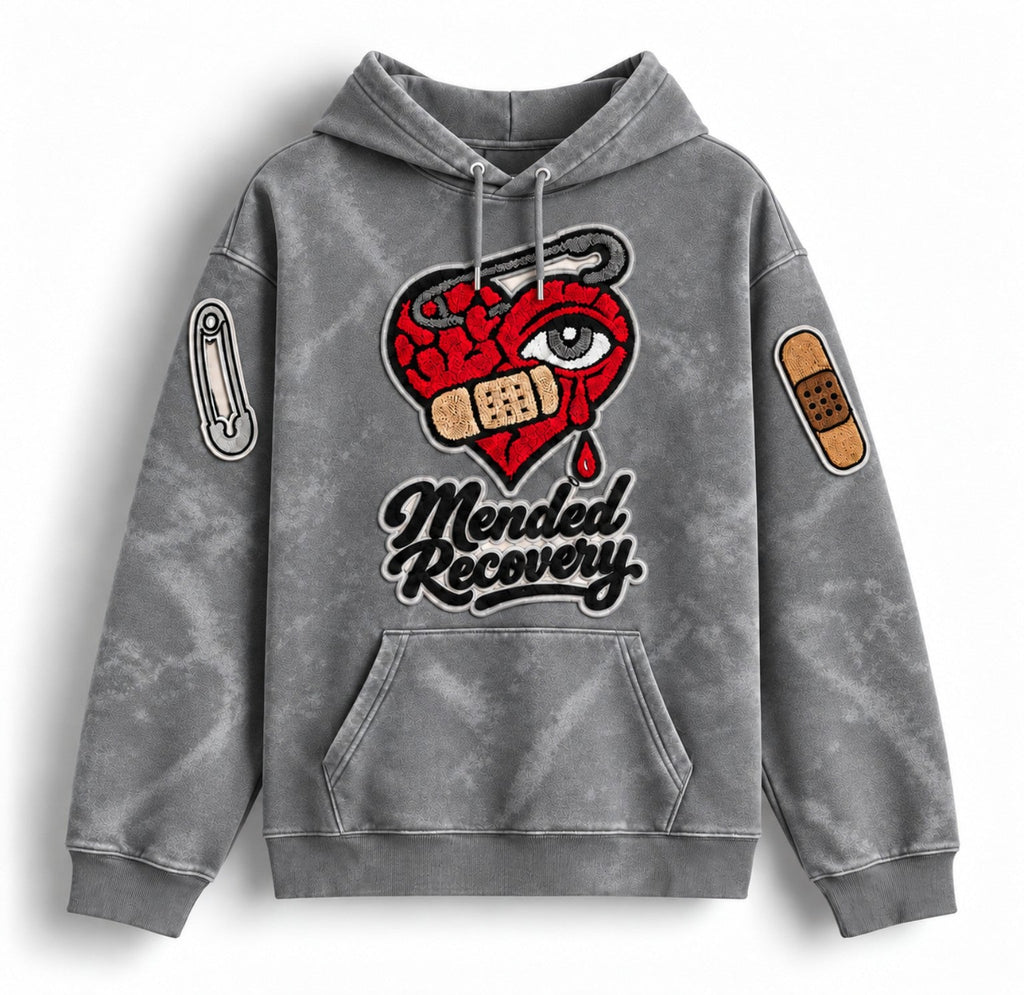 Gray distressed Mended Recovery hoodie – sleeve patch statement layout