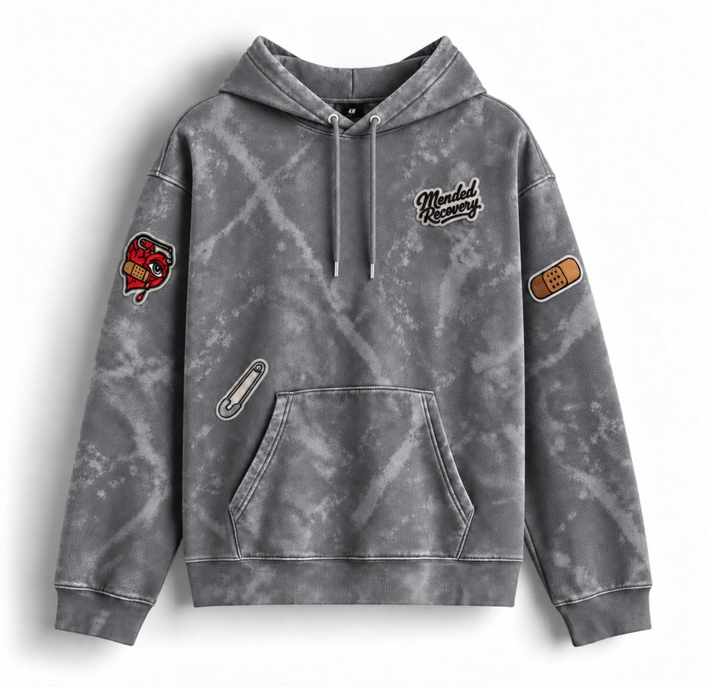 Gray distressed Mended Recovery hoodie – patch layout
